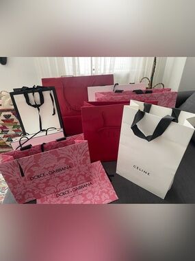 Assortment designer shopping Bags Gucci Chanel Celine Valentino Dolce & Gabbana